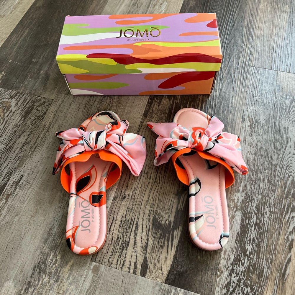 Bow tie slip on sandals.